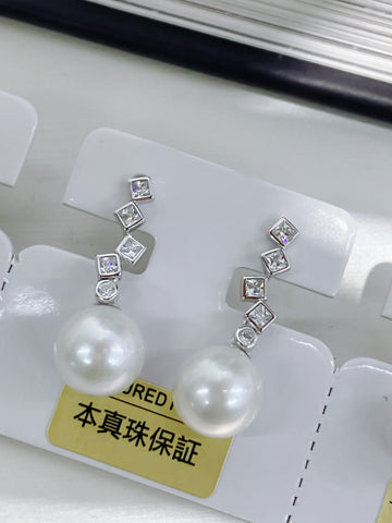 爱迪生珍珠耳钉 | 12–13毫米 · 圆形 · 光泽强烈 · 近乎完美 · S925 纯银