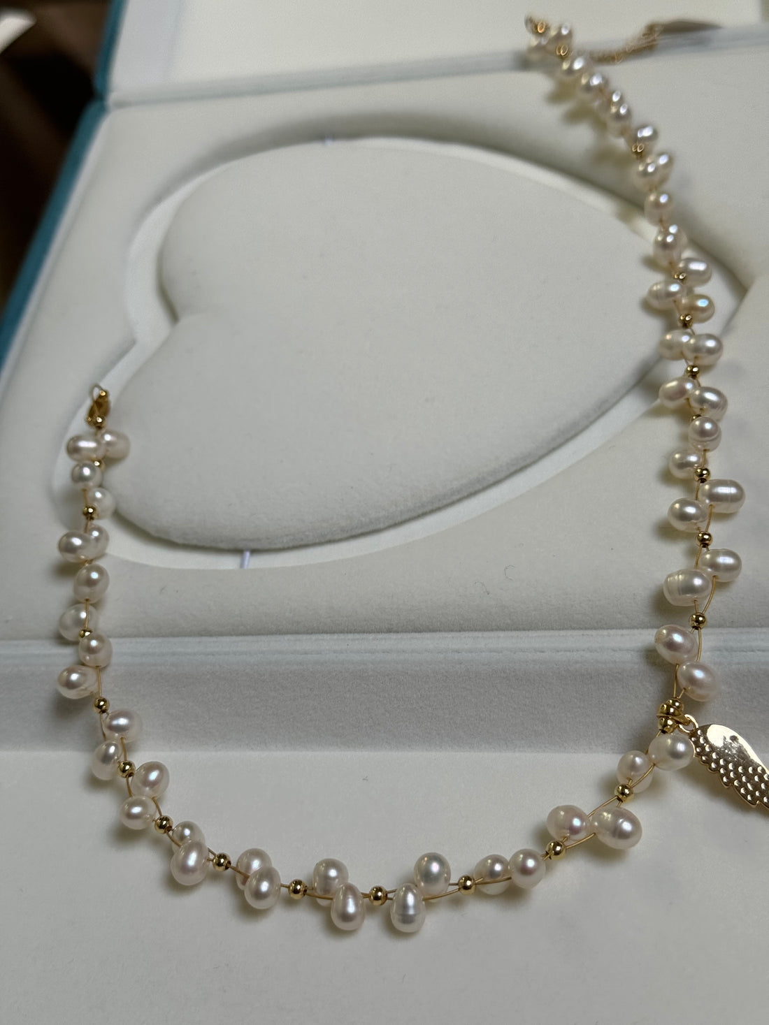 Freshwater Pearl Wing Pendant Necklace | 7–8mm Oval Pearls · 10mm Accent Pearl · Stacked Flat Baroque Pearls · Zircon Wing Pendant · Adjustable Length